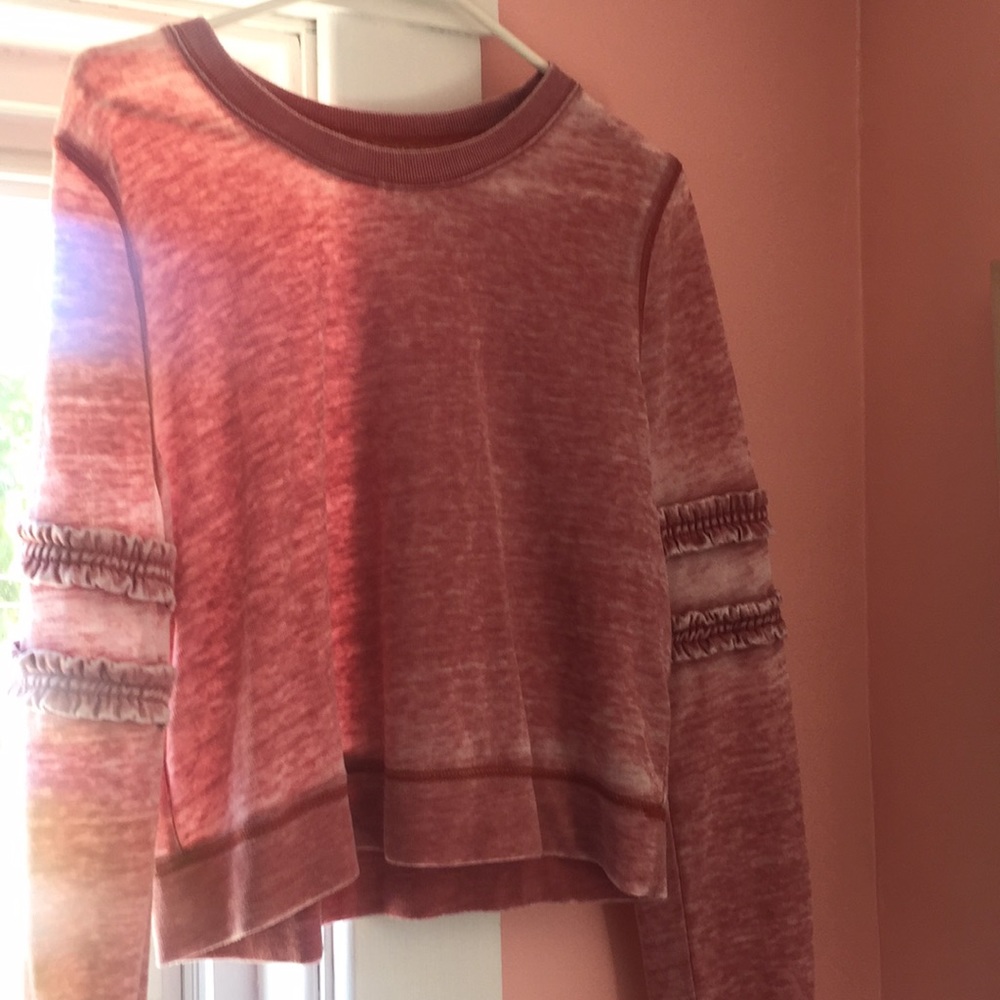 Light purple/white sweatshirt, slight crop